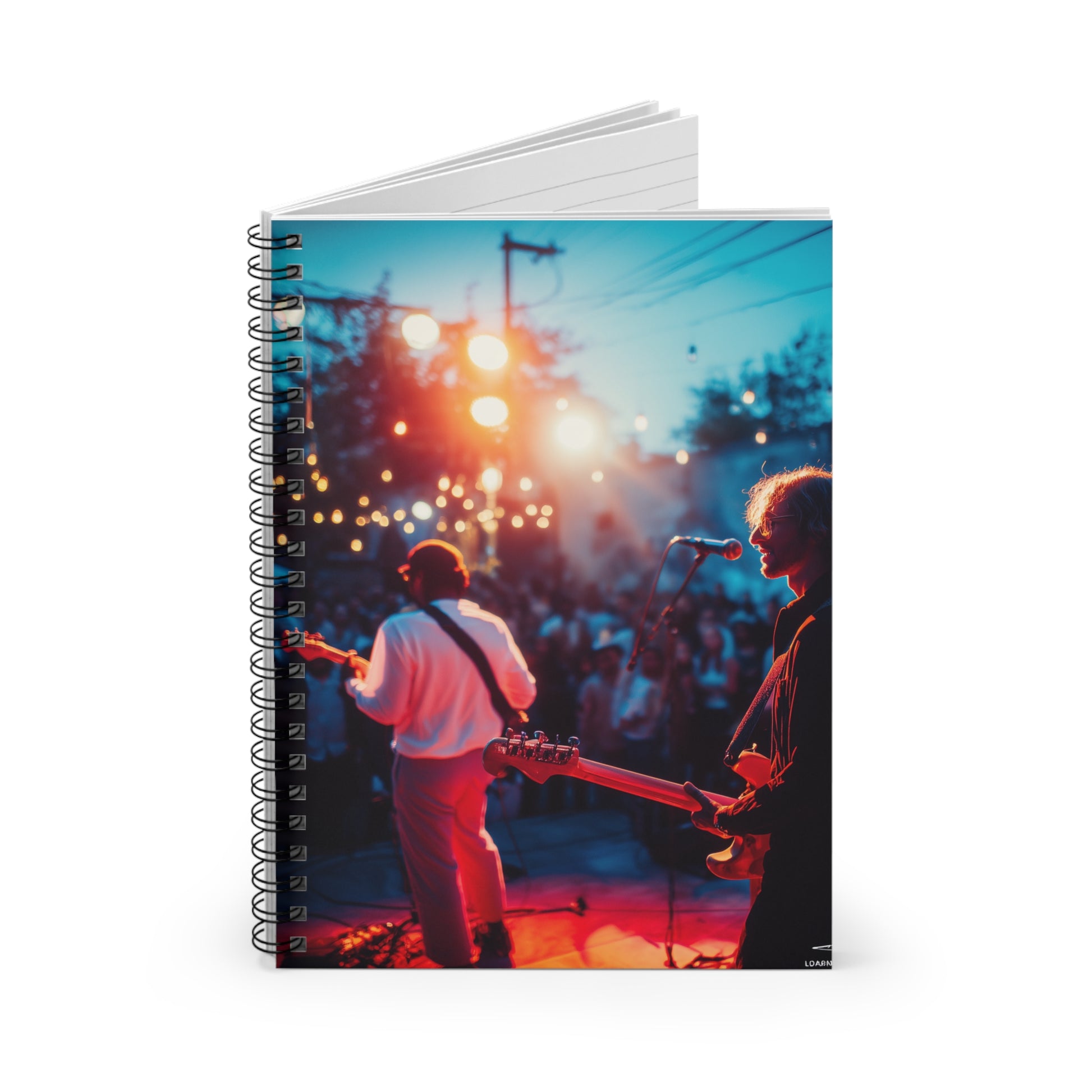 concert notebook open on vintage stage showing ruled pages with handwritten lyrics and sketches
